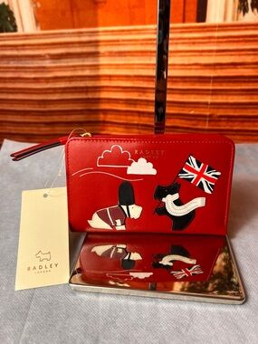 NWT Radley London On Parade red bifold wallet, crafted from smooth leather